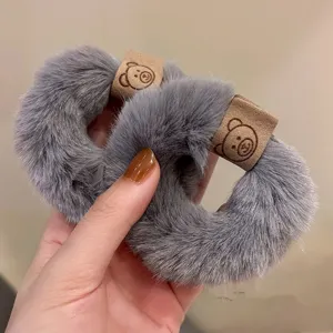 Grey plush hair scrunchies with cute bear leather patch, soft furry winter hair ties for women.