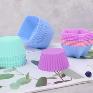 Colorful silicone cake molds set, heat-resistant muffin cups and kitchen baking tools.
