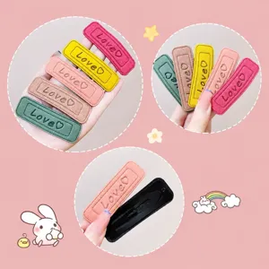 Detailed close-up of leather square hair clips, featuring cute candy colors and love text.
