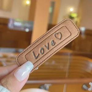 Brown leather hair clip with love letter and heart embossing minimalist cute accessory