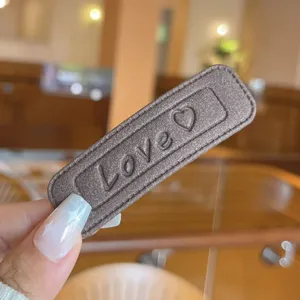 Leather square hair barrette with love embossing detail, stylish candy color hair clip for women.