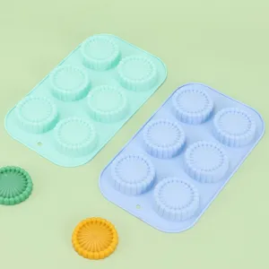 Detailed view of the 6-cavity silicone baking mold showcasing the fine sunburst texture.