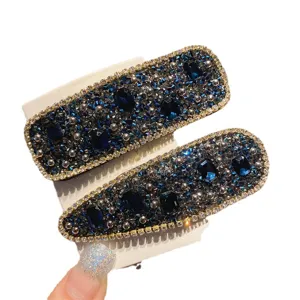 Blue rhinestone hair clips set, sparkly crystal bobby pins for women and girls styling.