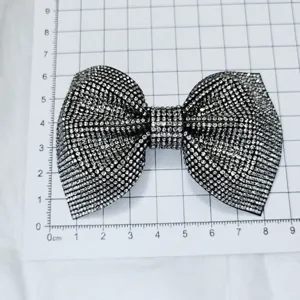 Detail shot of sparkling rhinestone bow shoe clip, stunning crystal accessory for DIY fashion.