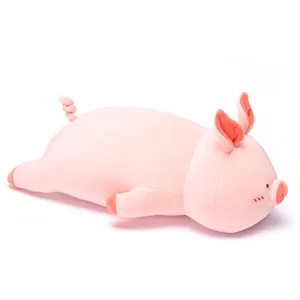 Cute pink sleeping pig plush toy pillow, soft stuffed animal doll for girls and kids.