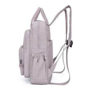 Side detail view of lightweight waterproof casual lavender backpack with multiple functional pockets.
