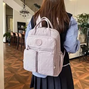 Detailed rear view of a chic crinkled nylon casual backpack featuring multiple storage pockets.