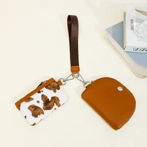 Stylish 2-in-1 women's wristlet wallet, cow print coin purse and brown card holder set.