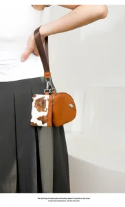 Fashionable two-in-one women wrist bag, chic cow print and brown design, mini wallet.