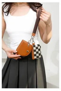 Stylish 2-in-1 women wristlet handbag set featuring brown pouch and chic checkerboard mini bag.