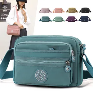 Women nylon crossbody shoulder bag multi-pocket casual daily handbag with adjustable strap.