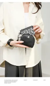 Detailed shot of a stylish 2-in-1 women wrist bag featuring leopard print and black coin pouch.