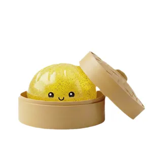 Süßes gelbes Glitzer Brötchen Antistress Spielzeug mit einem Mini Dampfkorb zur Entspannung.