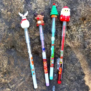 Christmas cartoon stacking pencils with cute Santa snowman toppers, fun stationery for kids.
