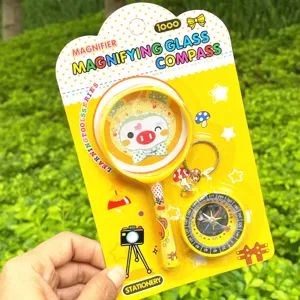 Kids magnifying glass and compass set, cartoon pig yellow plastic toy for school student learning.