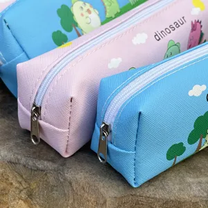 Detail shot of cute cartoon dinosaur single-layer pencil case, durable fabric with smooth zipper.