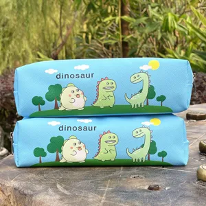 Detailed view of cute cartoon dinosaur pencil case showing fun patterns and zipper design.