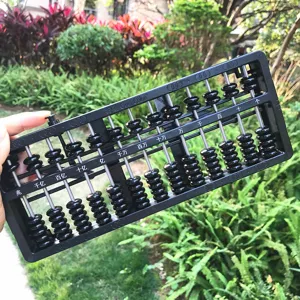 Close-up detail of a black 13-rod abacus with auto-reset beads for kids math learning.