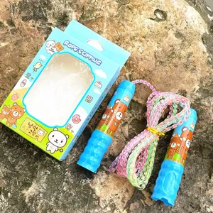 Kids colorful skipping rope with cute cartoon bear handles and matching gift box detail.