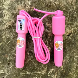 Close-up detail of a pink mechanical counting jump rope with cute cartoon bear stickers.
