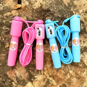 Children counting jump rope with mechanical counter and cute bear stickers for outdoor kids fitness.