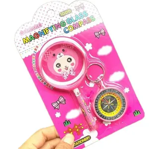 Kids compass and magnifying glass set, cute pink cartoon exploration toy for children.