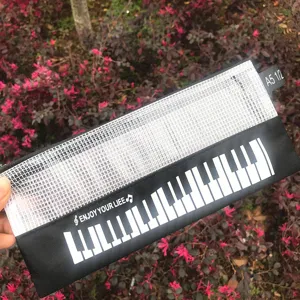 Estuche de malla con diseño de piano creativo, bolsa de papelería negra y blanca para estudiantes.