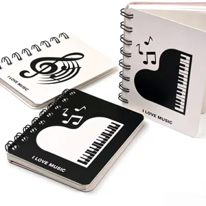 A7 Spiral Notizbuch Detailansicht mit niedlichem Klaviertasten und Noten Cover Design.