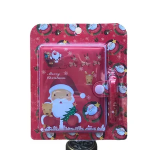 Cute cartoon Santa Claus notebook and pen set, perfect Christmas gift for kids and students.