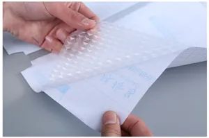 Transparent frosted self-adhesive book cover film A4 size with grid backing for school kids.