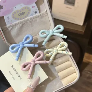 Cute bow hair clips with sweet polka dot design, perfect side bangs hair accessories for girls.