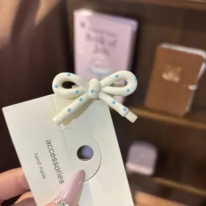 Cute blue dot bow hair clip sweet side bangs hairpin stylish fashion hair accessories for girls.