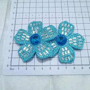 Blue rhinestone flower DIY accessory detail showing sparkling crystal patches for shoes bags.