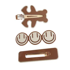 Lot de 3 pinces à cheveux marron pour femmes avec des motifs d'ours et de smiley pour l'automne.