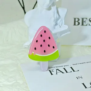 Cute watermelon popsicle acrylic hair clip detail view, vibrant kids hair accessory item.