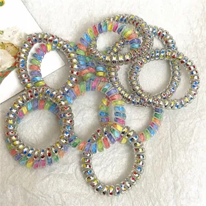 Detailed view of colorful gradient star telephone wire hair coils, high elasticity and cute design.