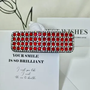 Red and clear rhinestone hair clip detail, sparkling crystal geometric barrette for women.