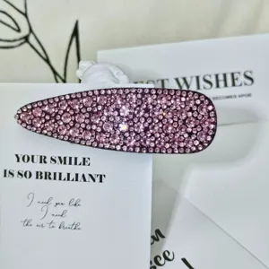 Sparkling pink rhinestone waterdrop hair clip elegant side hairpin for women styling.