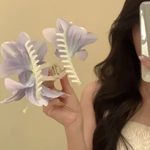 Detailed close-up of large lily flower hair claw clip, 3D floral design for elegant hairstyles.