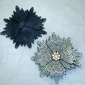 Handmade rhinestone snowflake shoe clip detail showing sparkling crystals and textured back.