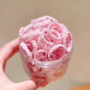 Simpatici elastici per capelli rosa per bambini, piccoli elastici in barattolo trasparente.