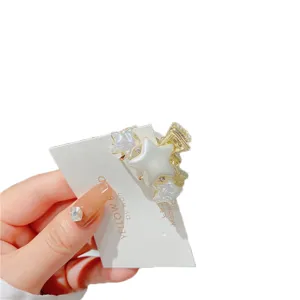 Korean style alloy imitation pearl star hair claw clip for women, elegant hair accessory.