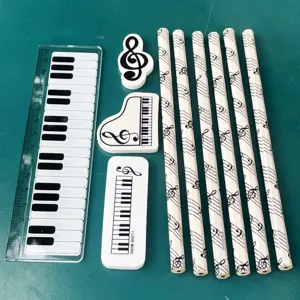 Creative music stationery set including piano ruler, cute erasers and musical note pencils.