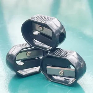 Set de sacapuntas ovalado de plástico negro portátil, papelería escolar útil.