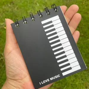 Blocco note a spirale tascabile A7 con design a tastiera di pianoforte, taccuino portatile.