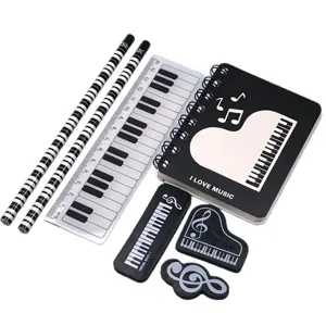 Student stationery set with piano music notes design including notebook pencils ruler erasers