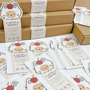 Cute cherry cat shaped sealing stickers and kraft gift boxes for journal and packaging decor.