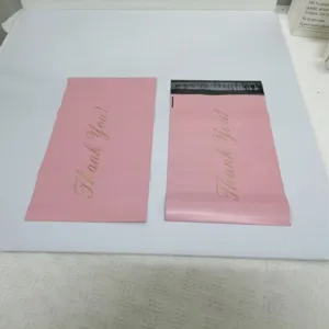 Pink plastic mailer bags with thank you text, thick waterproof shipping envelopes for mailing.