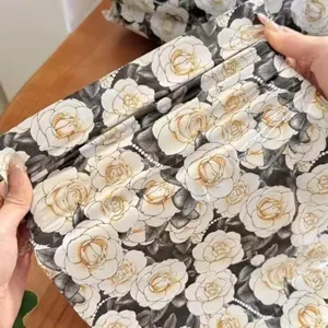 Camellia floral print waterproof mailing bag for stylish clothing packaging and gift delivery.