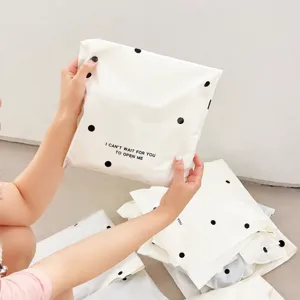 White polka dot mailing courier bag detail view, waterproof thickened shipping packaging.